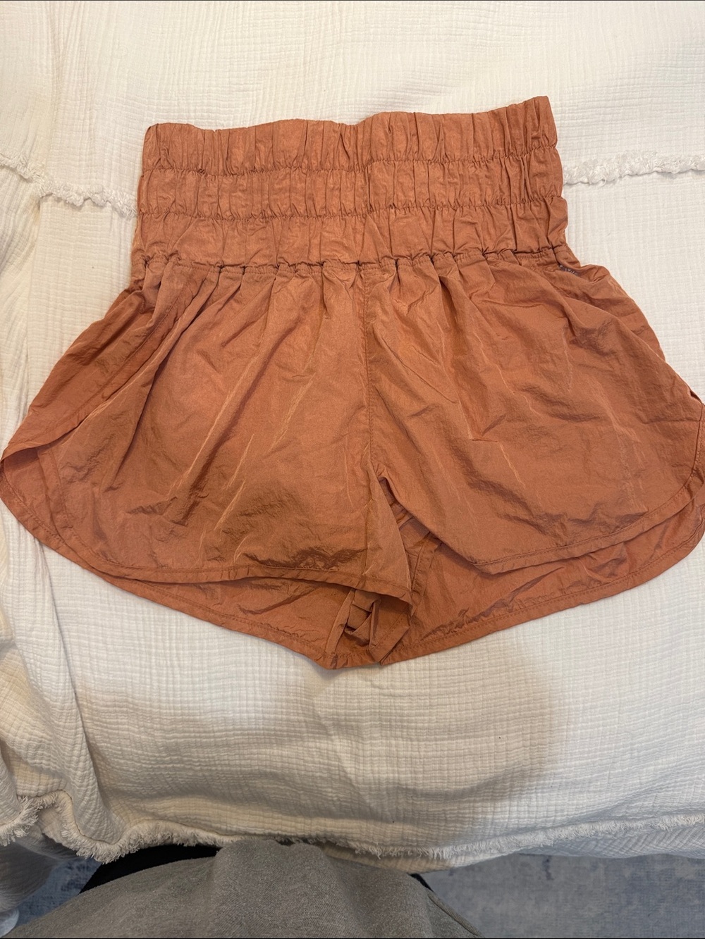 FP Movement by Free People Smocked-Waist Athletic Shorts in Rust